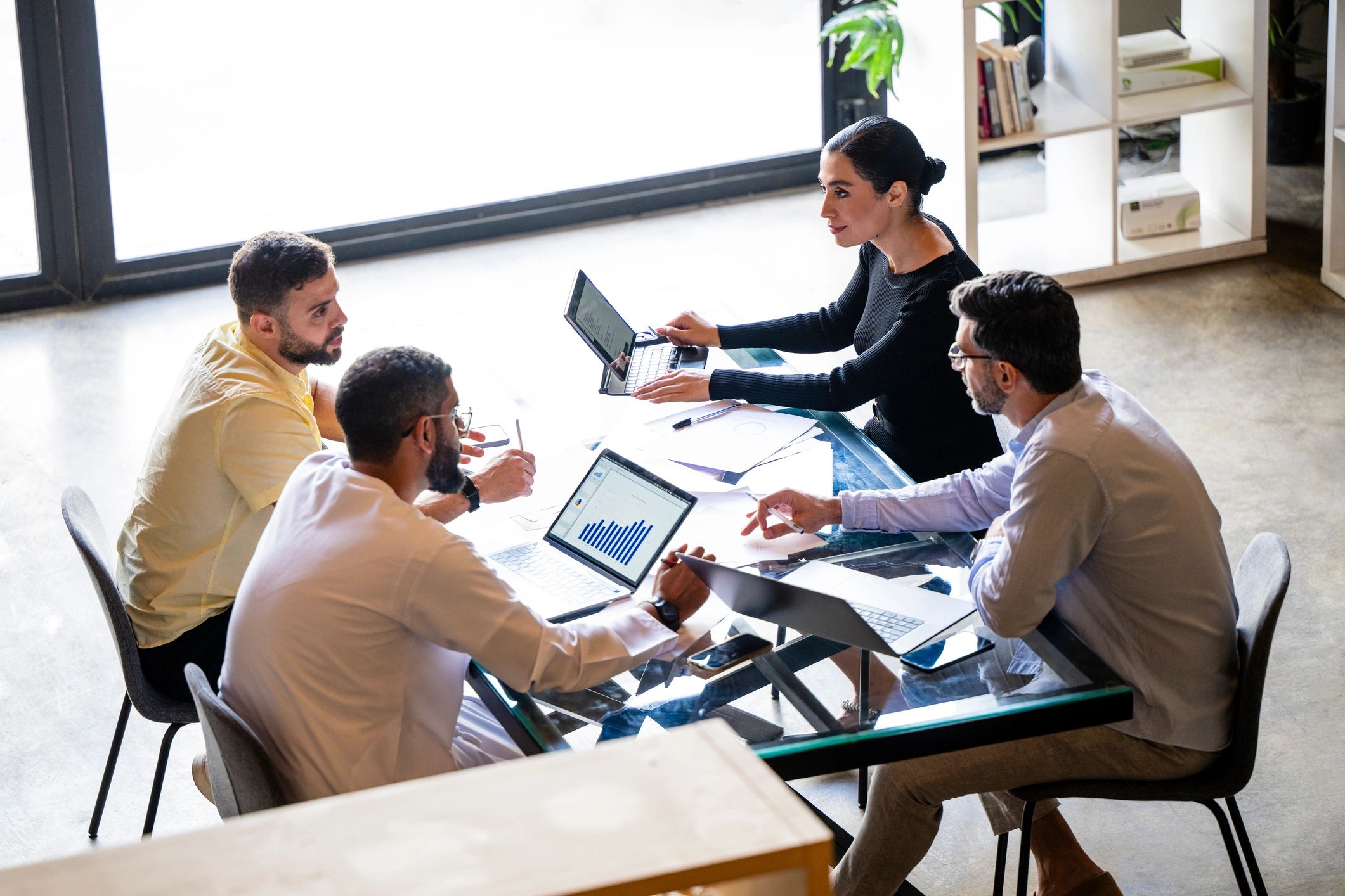 IT services team collaborating in a modern office